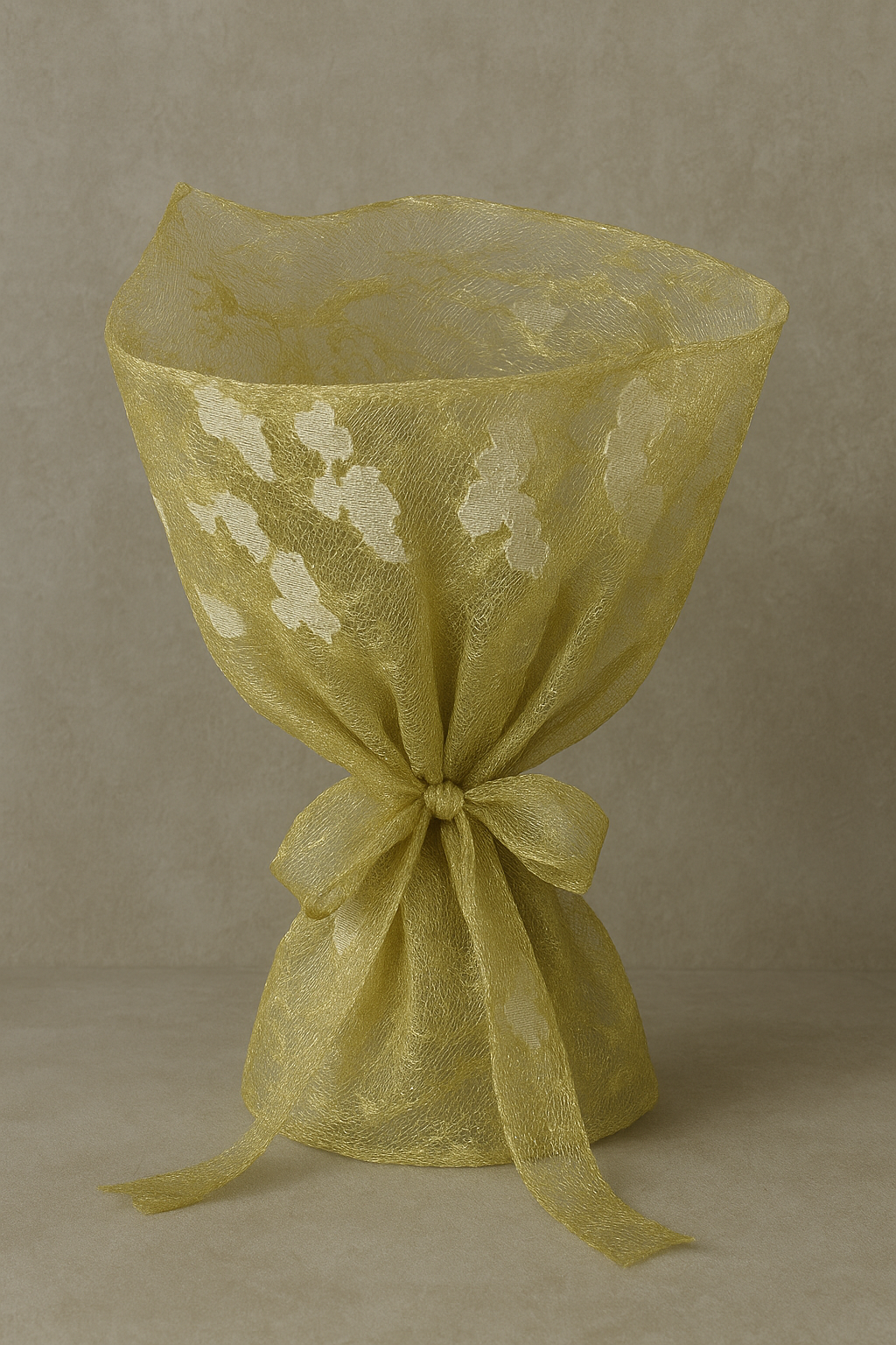 Beautiful golden net fabric with subtle embroidered thread work, perfect for elegant dupattas, lehengas, and unique decorative purposes.