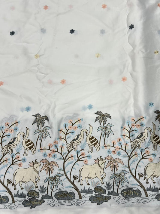 Premium ivory malai satin kurta fabric showcasing pastel cow and bird embroidery with elegant daman border for celebrations