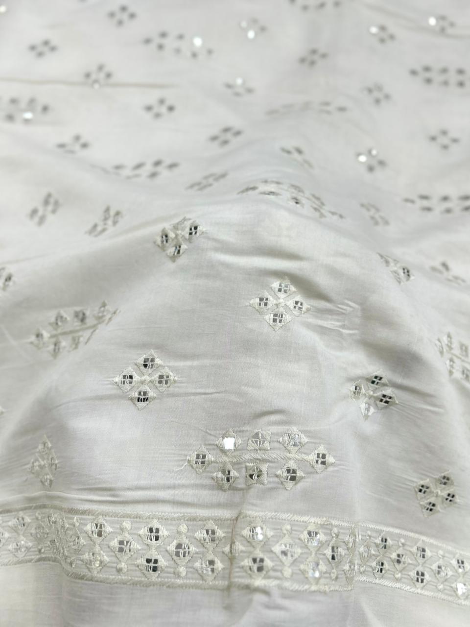 Premium white Roman silk fabric for children with subtle sequin work.