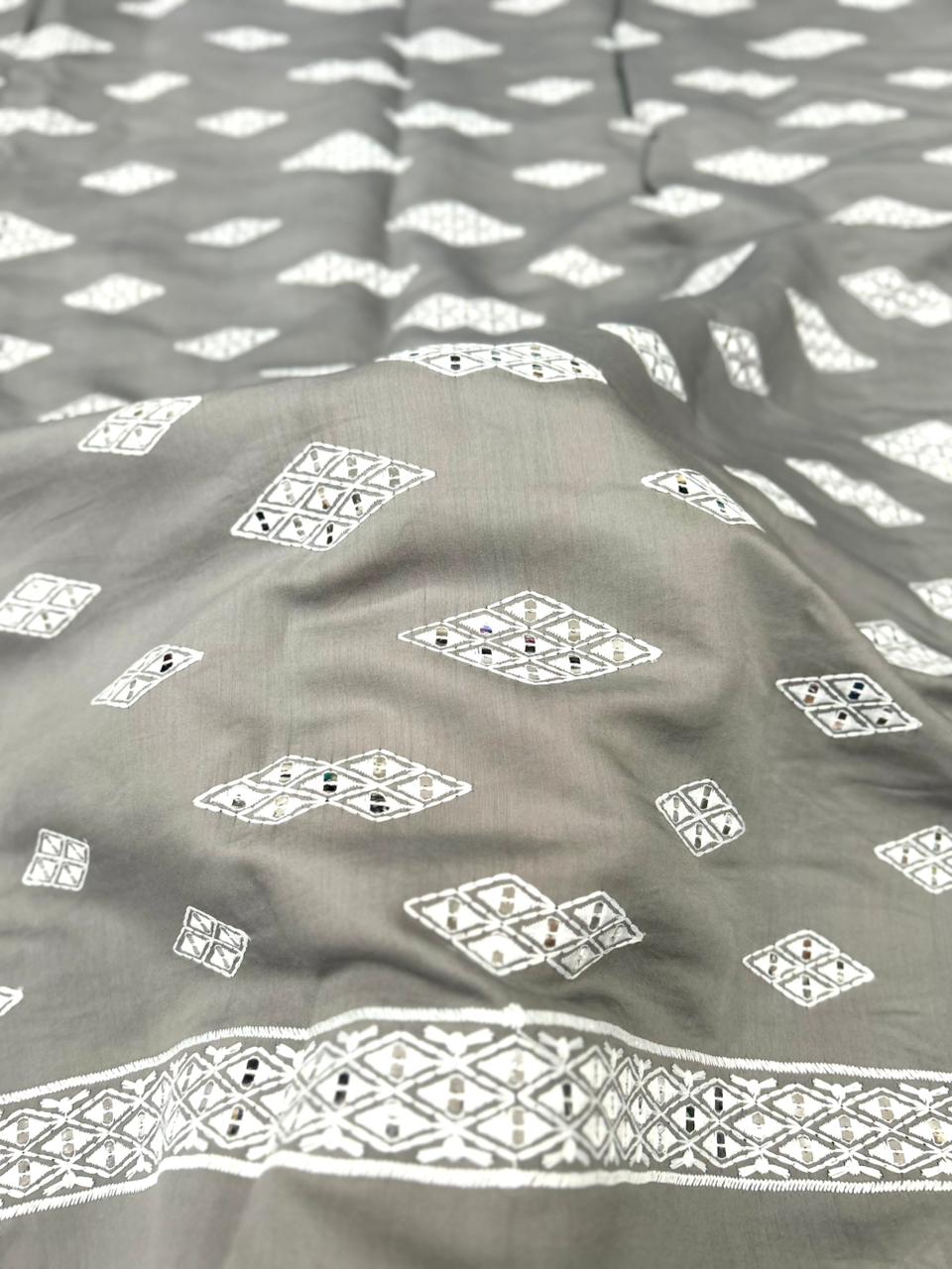 Premium grey Roman silk fabric for men with mirror accents and white embroidered motifs — ideal for wedding wear.