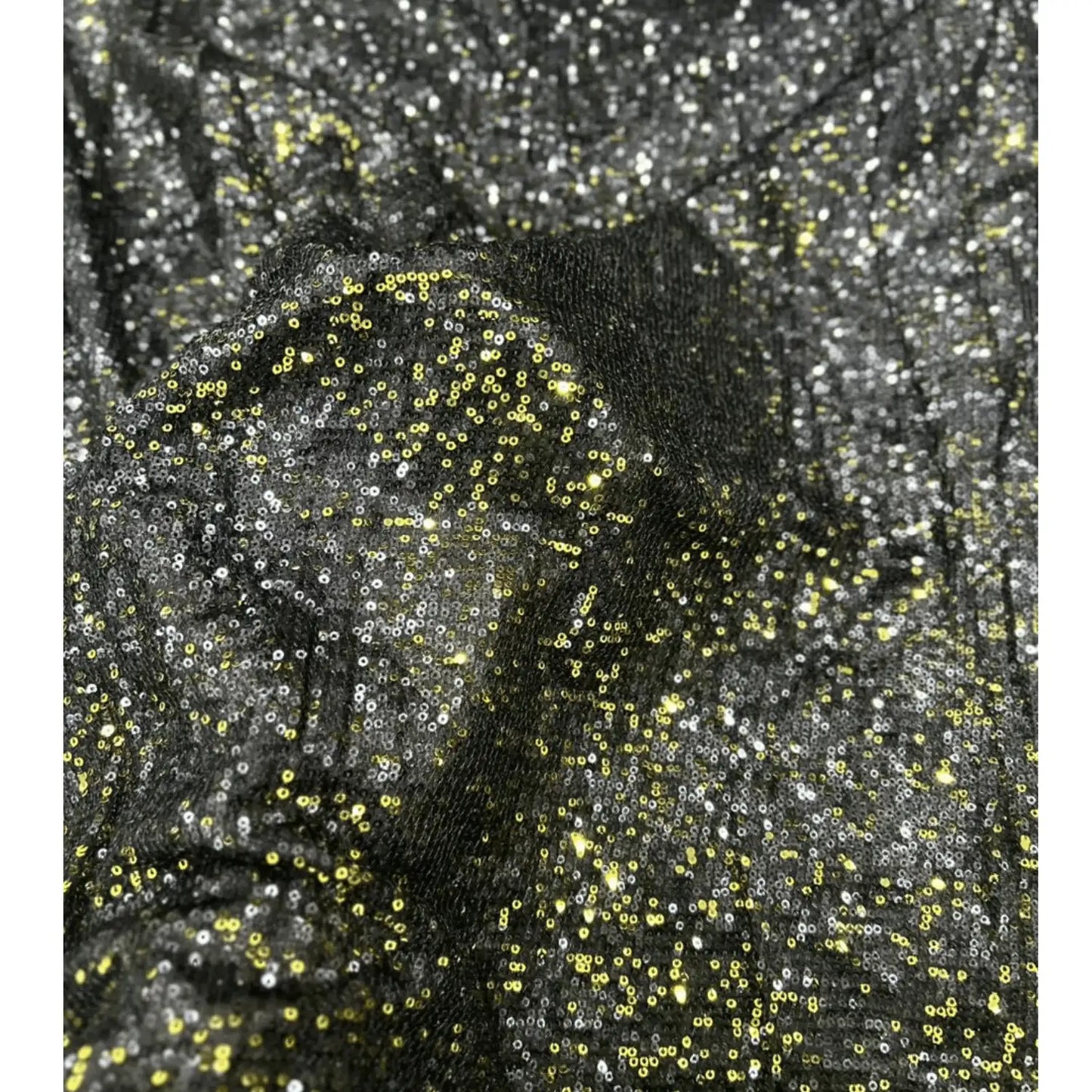 Close-up of premium black gold dual tone sequin net fabric featuring dense all-over gold and silver sequins on a soft net base, highlighting its luxurious sparkle, rich texture and designer finish for bridal, party wear and festive outfits.