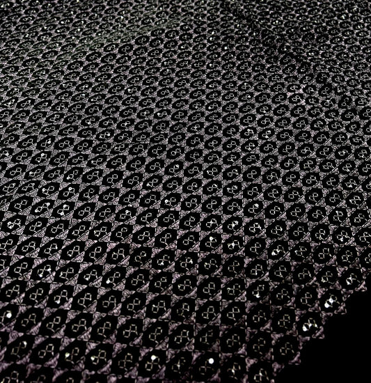 Luxury black base velvet fabric showcasing wine-purple geometric design for wedding and partywear menswear.