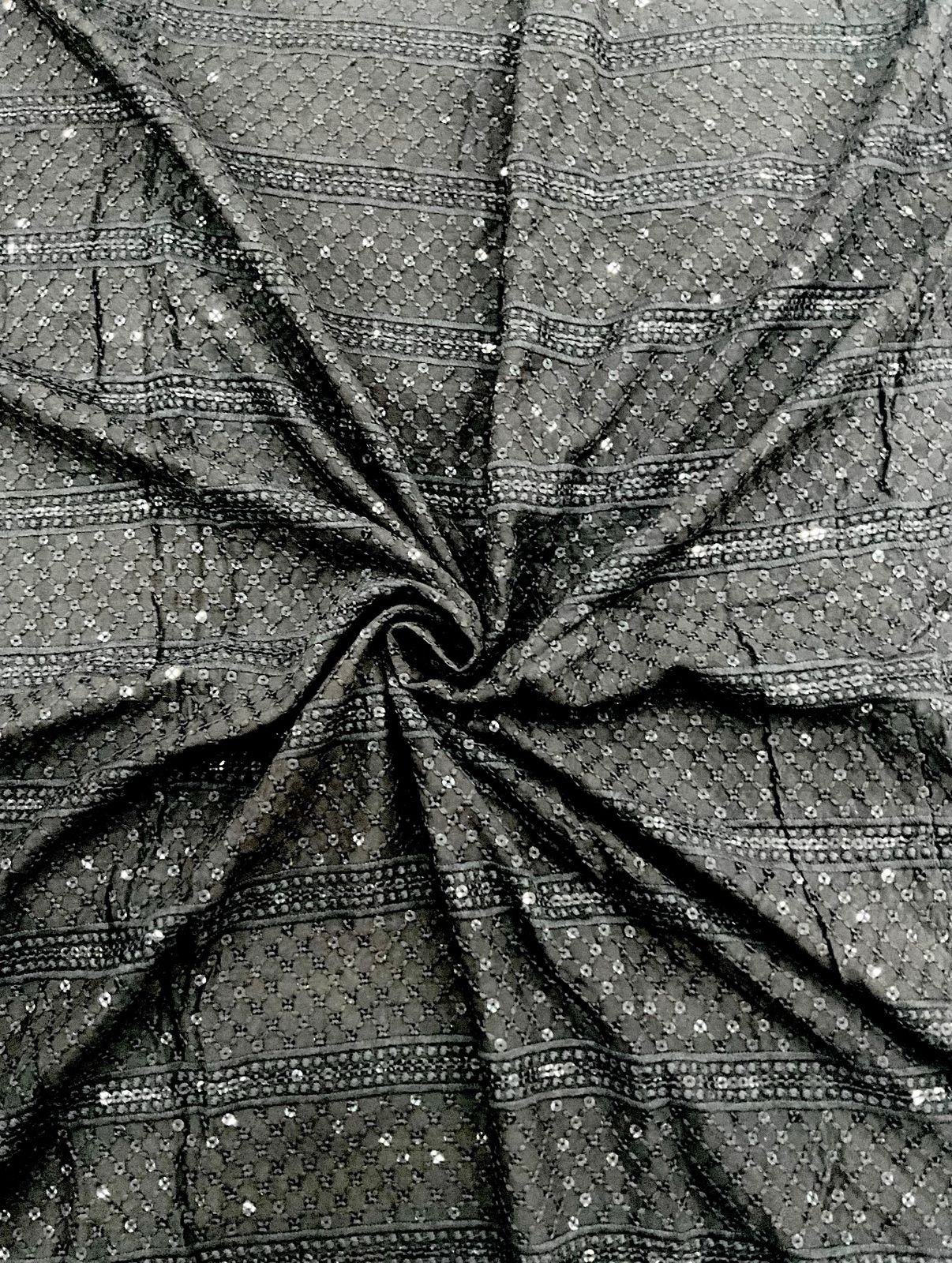 Designer black mirror-work fabric shown with child wearing matching kurta — ideal for festive wear, party outfits, and traditional event clothing.