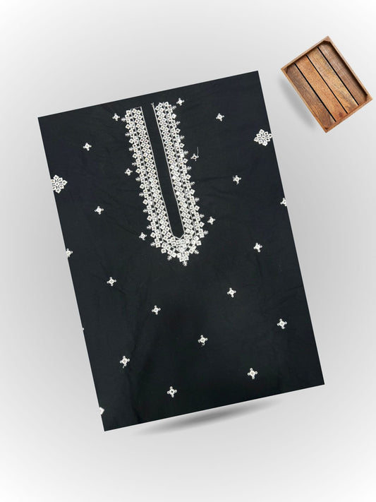 Black fabric with white embroidery on a light gray background