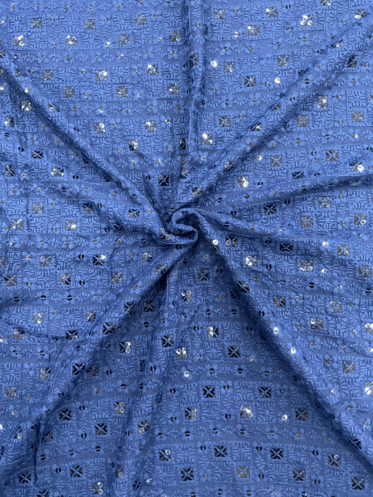 "Designer blue chikankari-style fabric shown with child model wearing matching kurta — ethnic wear for kids, party and festive collection."