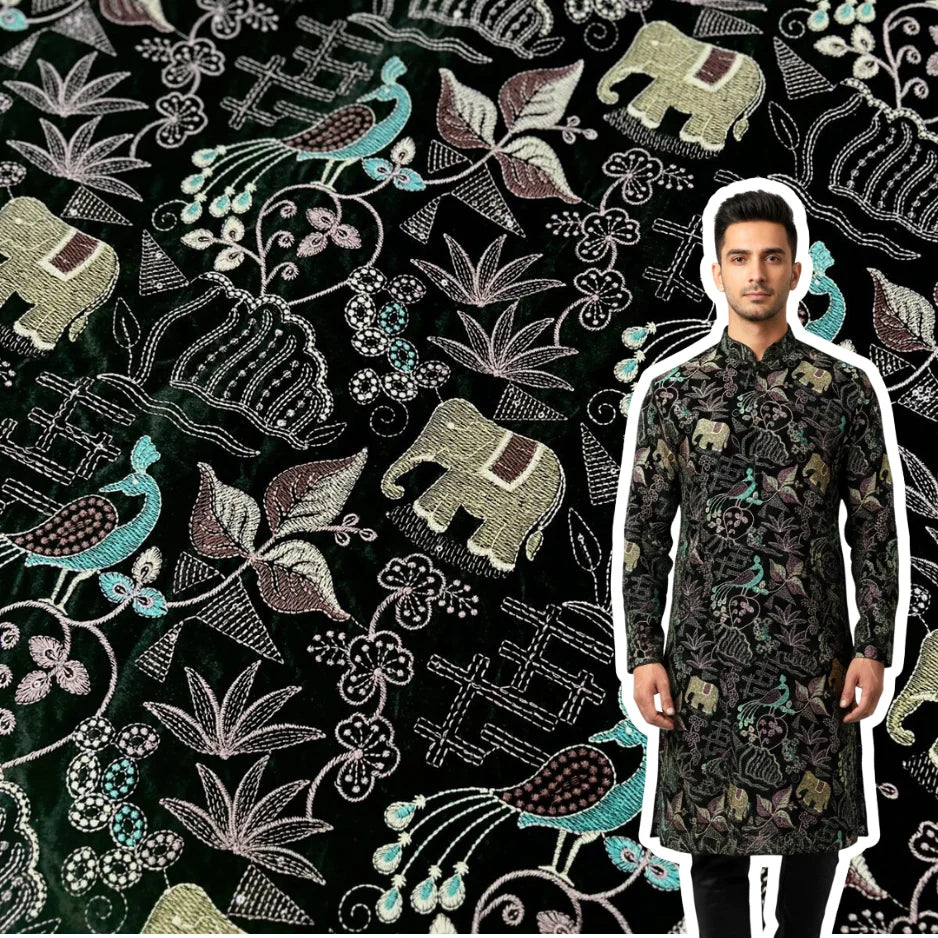 Premium black velvet fabric with multicolor embroidered elephants, peacocks, and floral motifs.