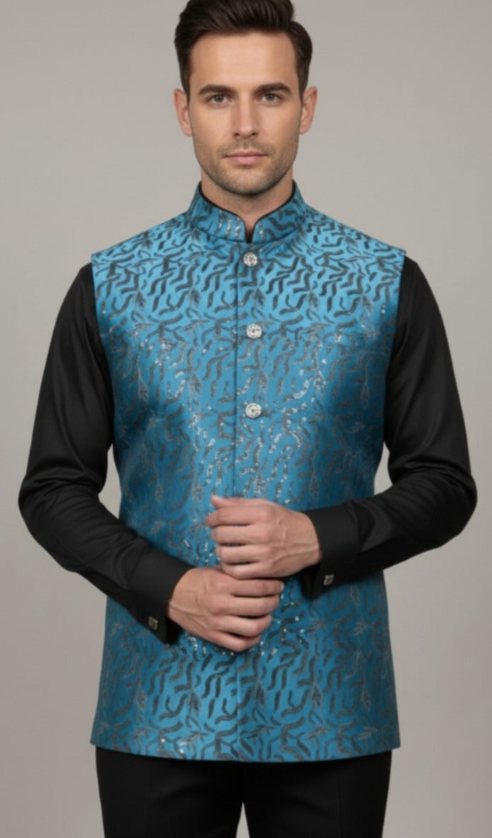 Blue TR satin fabric with heavy embroidery and sequin detailing, luxury outfit material for festive and wedding wear.