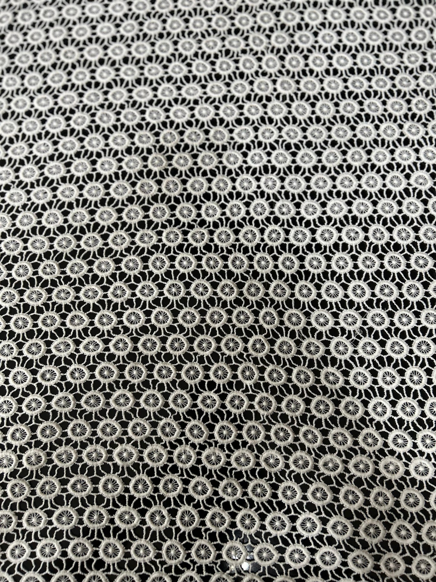 Premium white circular cutwork lace fabric with dense embroidered net design — ideal for kurtis, tops and designer dresses.