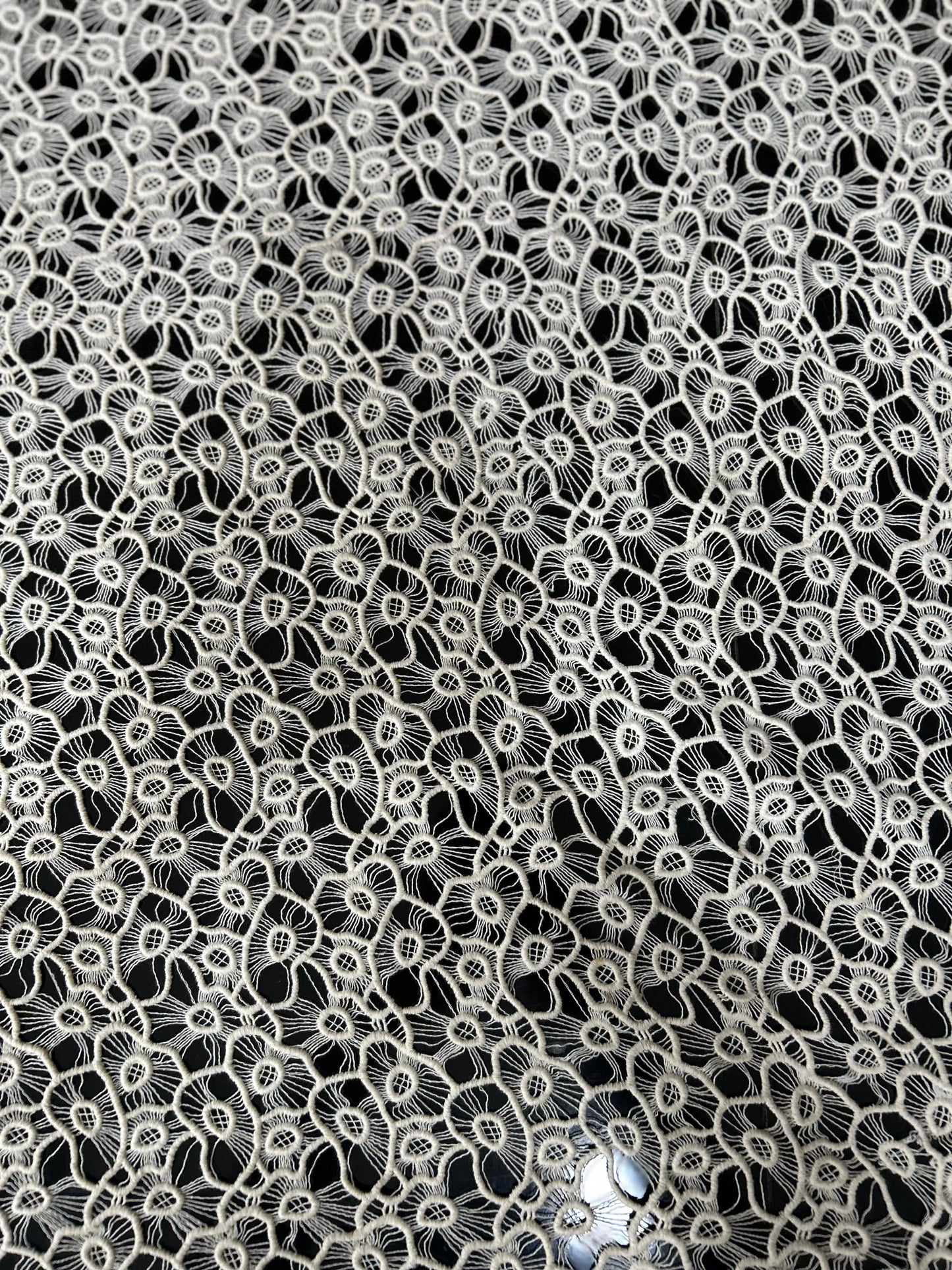 Premium white floral cutwork lace fabric with dense thread embroidery — ideal for tops, beach cover-ups and designer dresses.