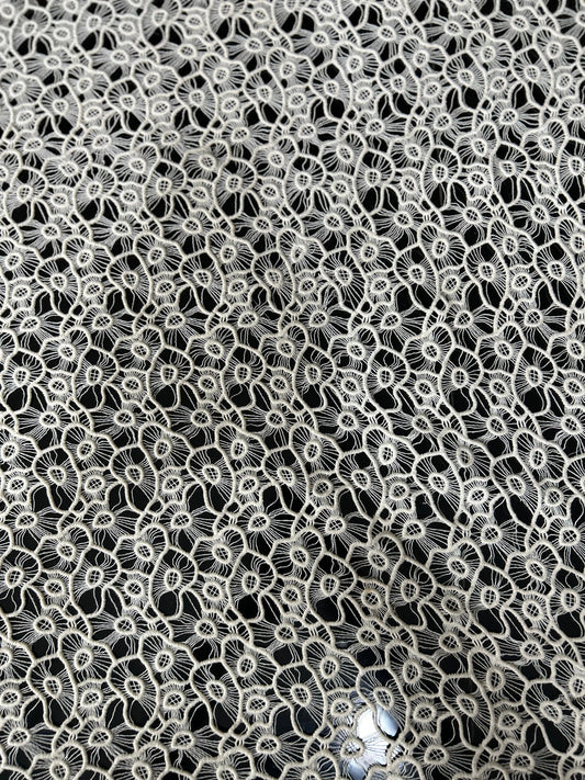 Premium white floral cutwork lace fabric with dense thread embroidery — ideal for tops, beach cover-ups and designer dresses.