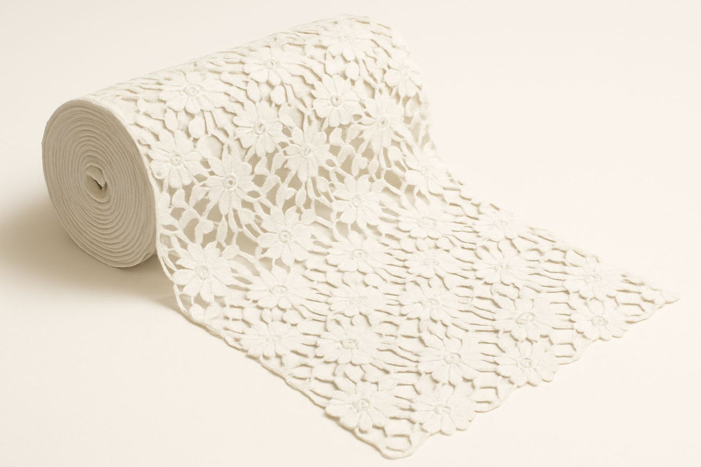 Close-up of white GPO Cotton Lace Fabric with a stunning wave-inspired floral guipure pattern; breathable, dyeable material suitable for high-fashion overlays, beach cover-ups, and ethnic wear.
