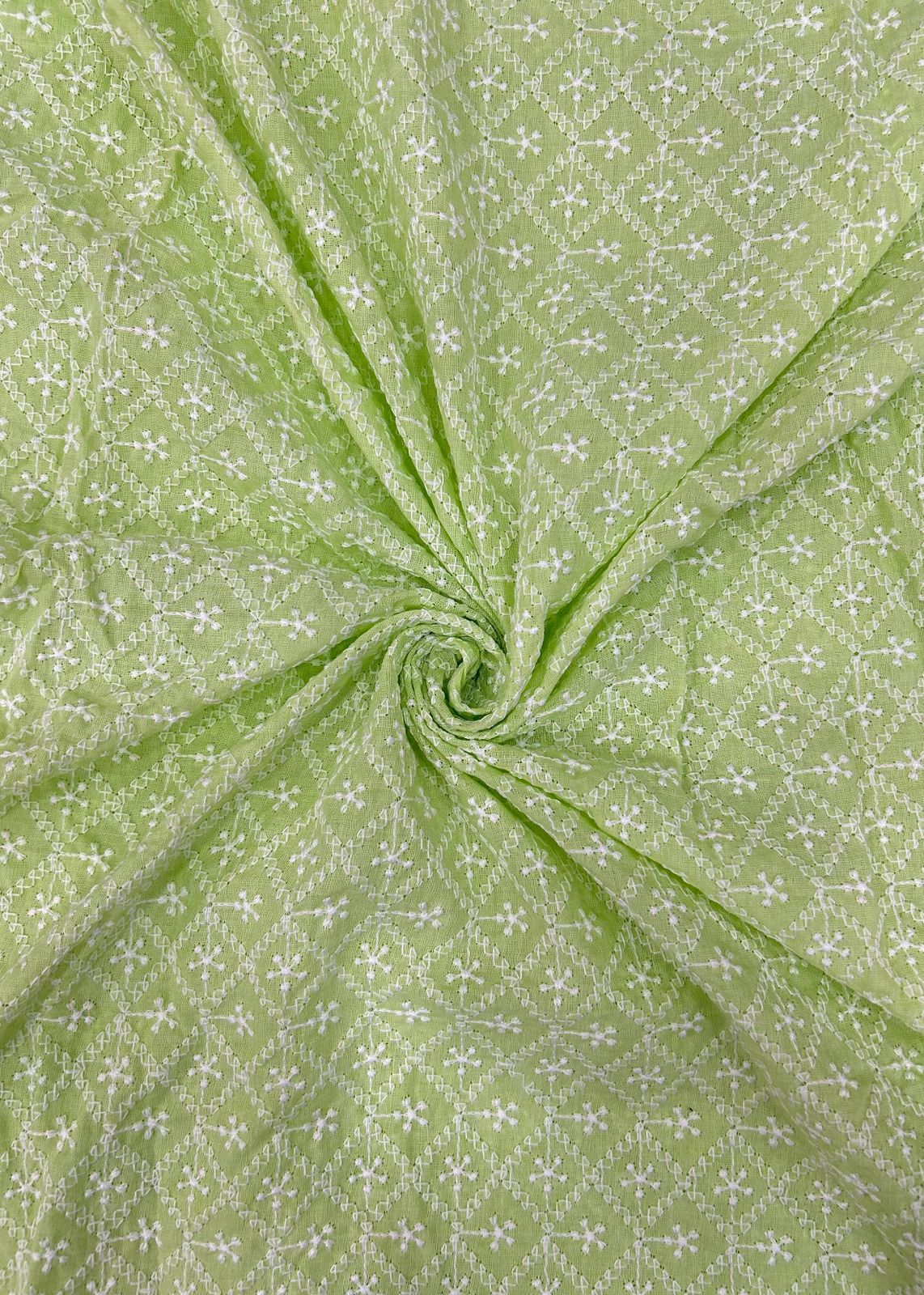 Light green embroidered kurta fabric next to a child wearing a matching kurta-pajama set, suitable for kids festive fashion, ethnic outfits, and special occasion dressing.