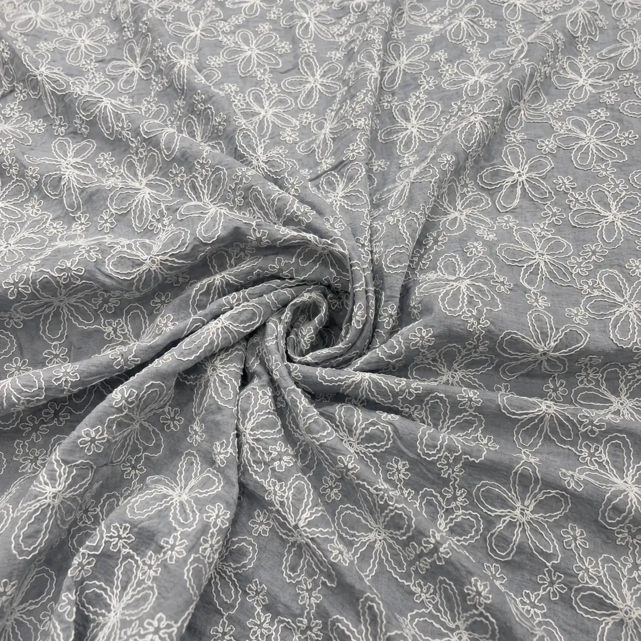 Grey Mal Chanderi fabric with white floral embroidery, premium lightweight embroidered fabric for kurti, salwar suit, ethnic wear, dresses, dupattas, festive outfits and designer apparel making.