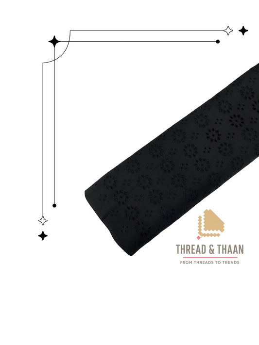 Premium black cotton fabric with delicate floral cutwork embroidery (Hakoba/Schiffli), perfect for elegant kurtas, dresses, and tops.