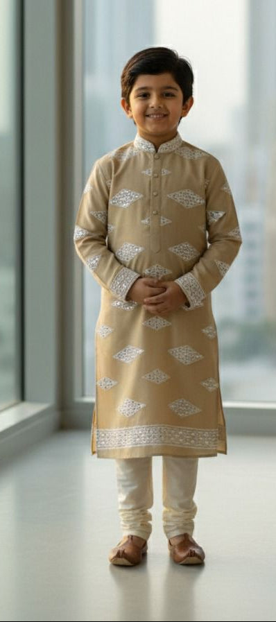 Premium kids kurta fabric in beige Roman silk featuring white mirror work embroidery — ideal for festive and wedding wear.