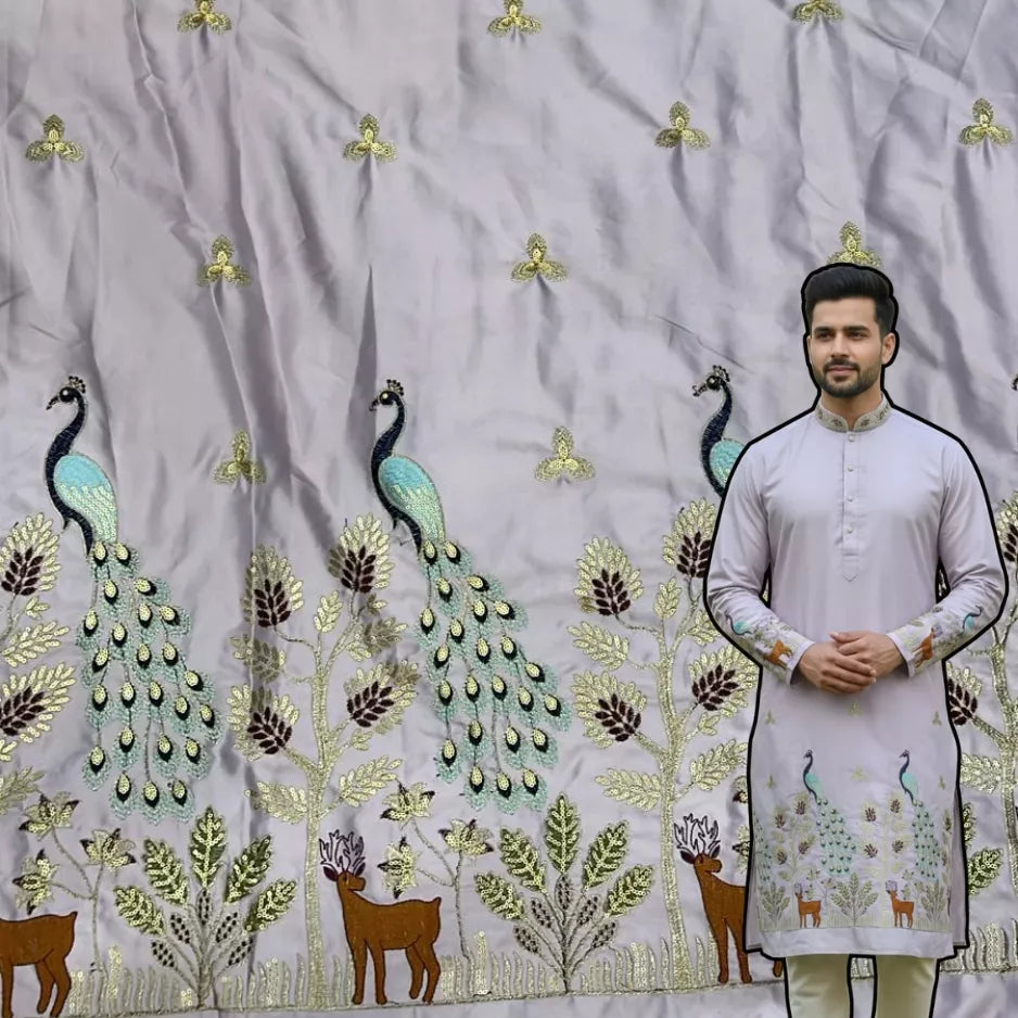 Premium lilac satin fabric with heavy peacock, tree and deer embroidery along the daman, ideal for festive men’s kurtas