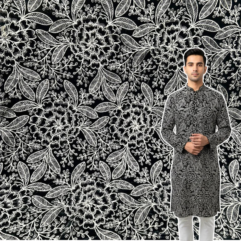 Beautiful new black velvet fabric with dense, delightful white and silver floral embroidery. It's so plush and ready for your most glamorous creations.