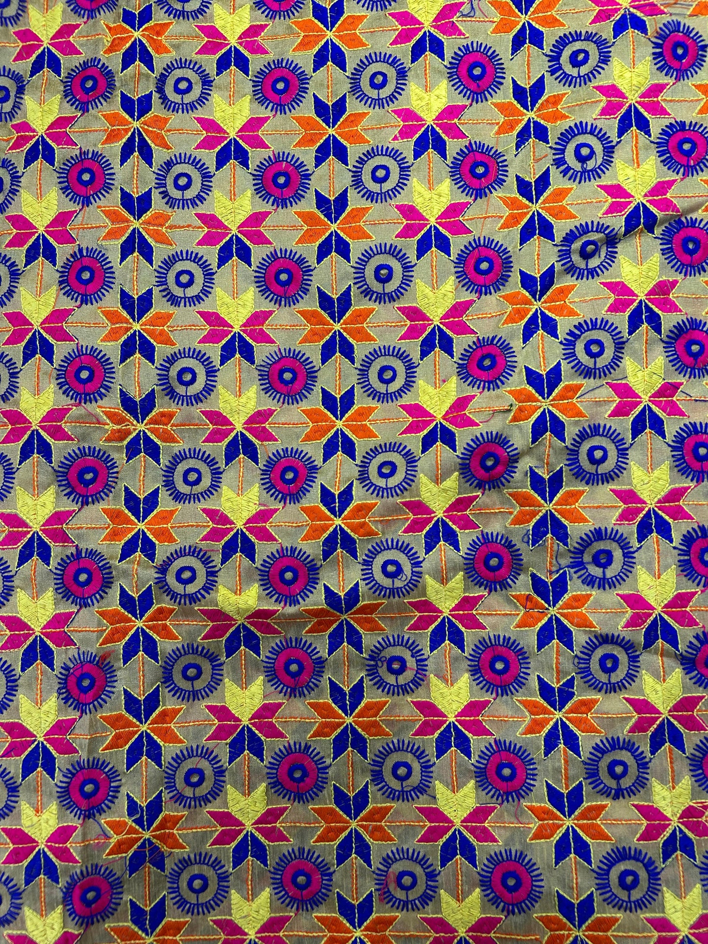 Multicolor brocade silk fabric with star and circular woven motifs for ethnic wear.