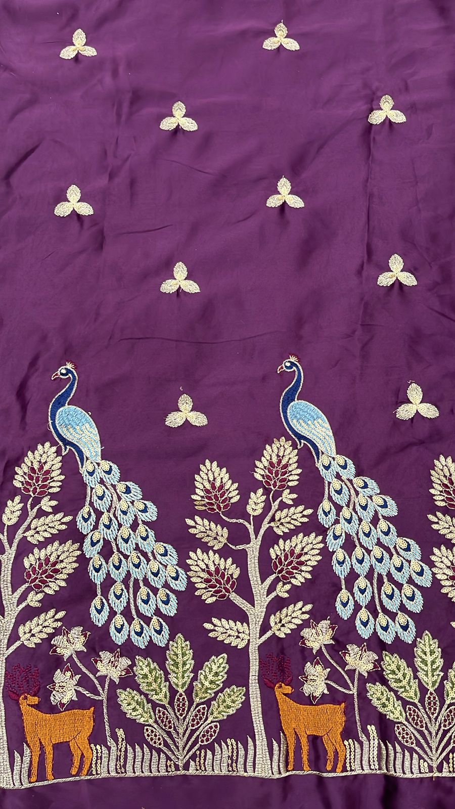 Deep plum malai satin fabric featuring detailed peacock and nature daman embroidery, ideal for men’s kurta and sherwani