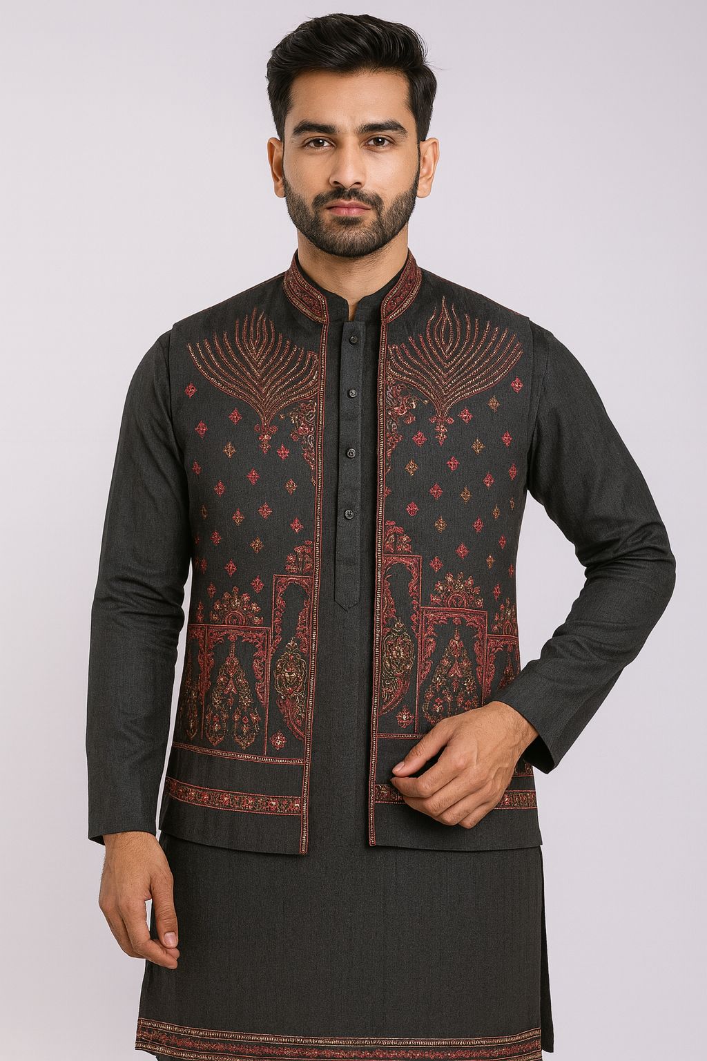 Unstitched black fabric for a men's Kurta, Koti, and Pajama set, showing the front panel of the Koti richly embroidered with traditional reddish-pink and gold patterns.