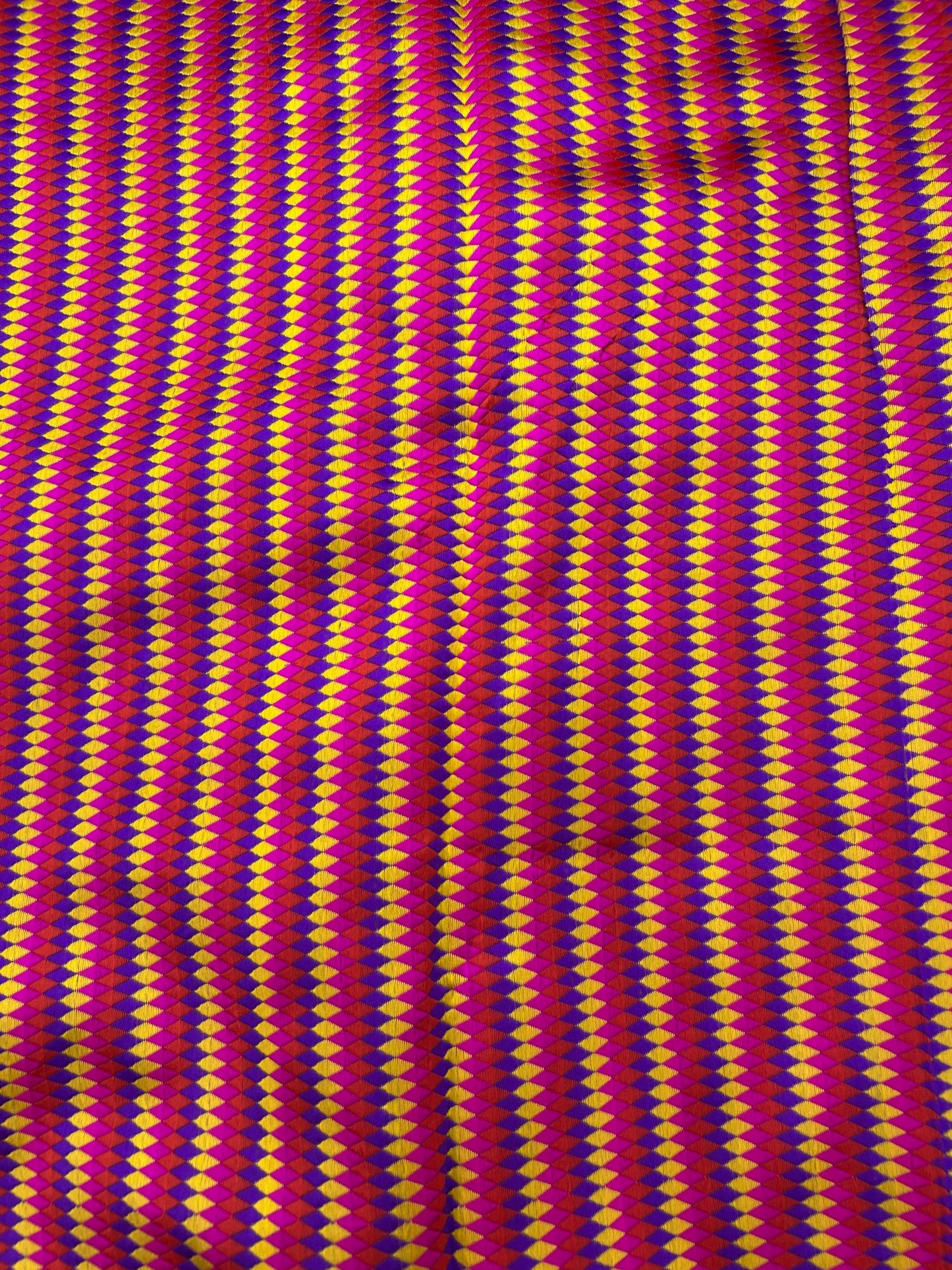 Premium striped silk brocade textile with pink and gold lines.