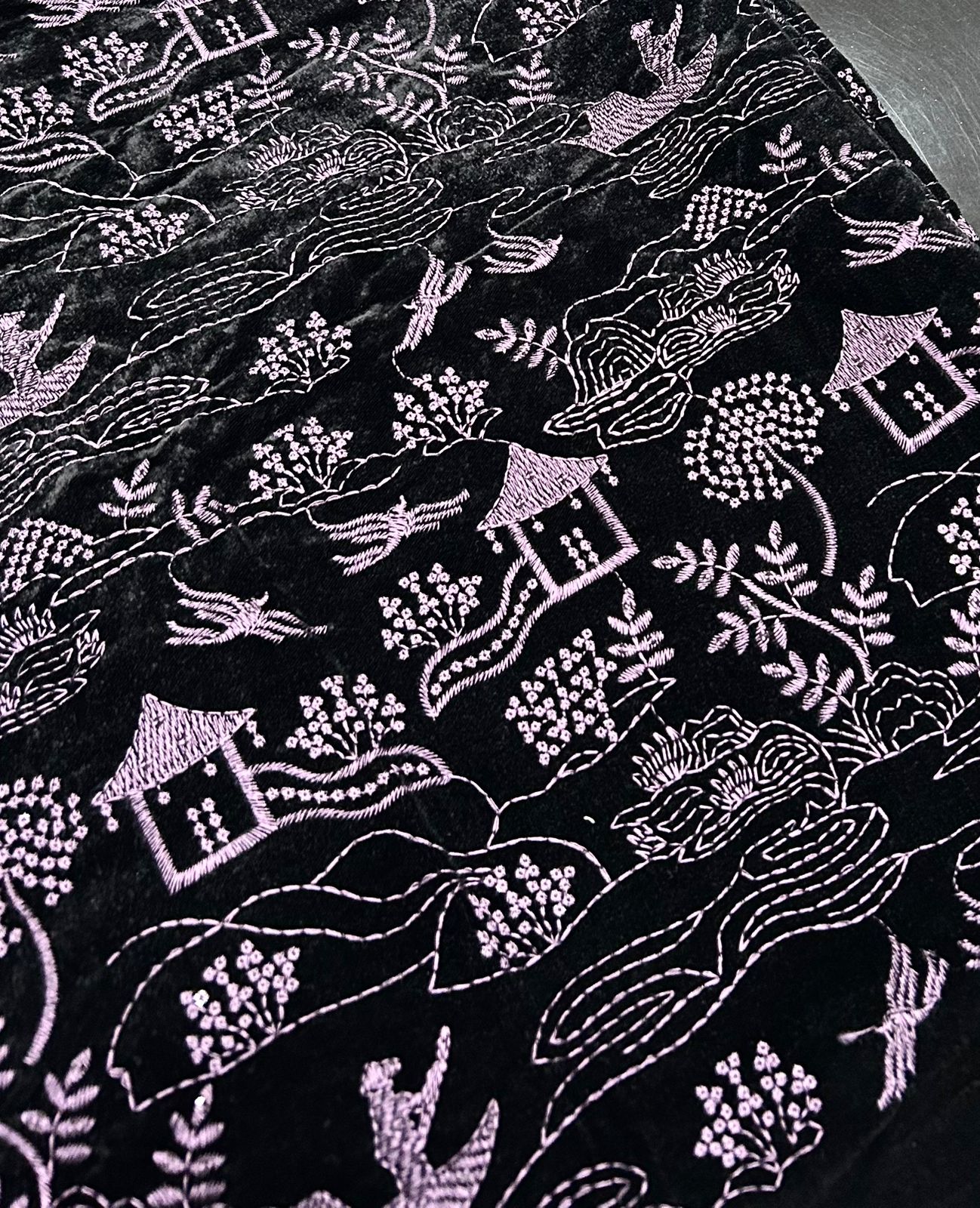 Premium winter velvet in dark purple featuring detailed scenic embroidery design.