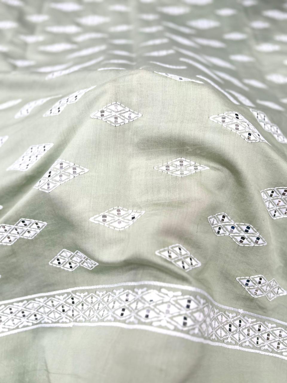 Pista green men’s kurta fabric with contrast white embroidery and mirror accents — soft 58-inch Roman silk.