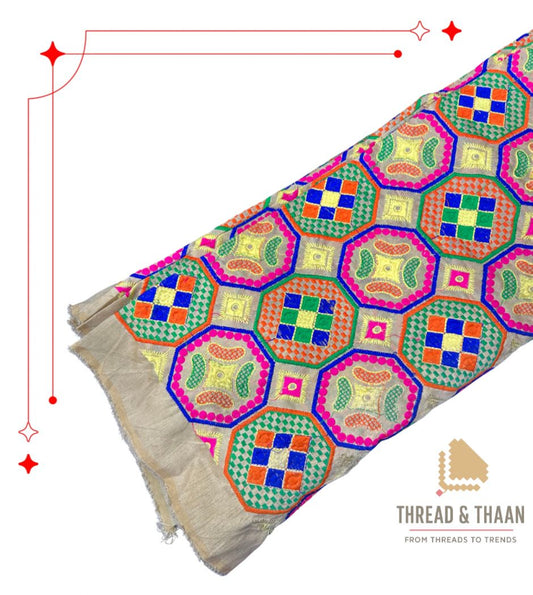 Premium silk brocade fabric featuring colorful geometric hexagon motifs for ethnic wear.