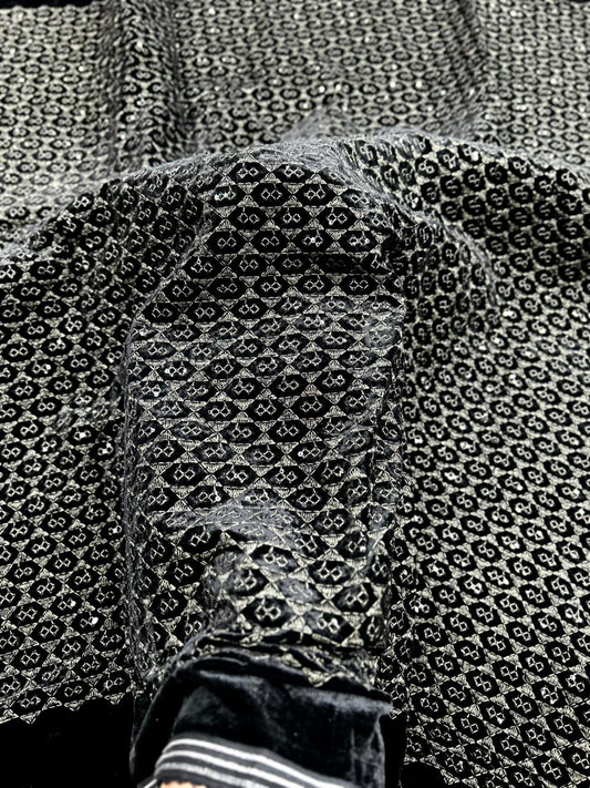 Luxury black base velvet fabric showcasing metallic olive geometric design for wedding and partywear menswear.