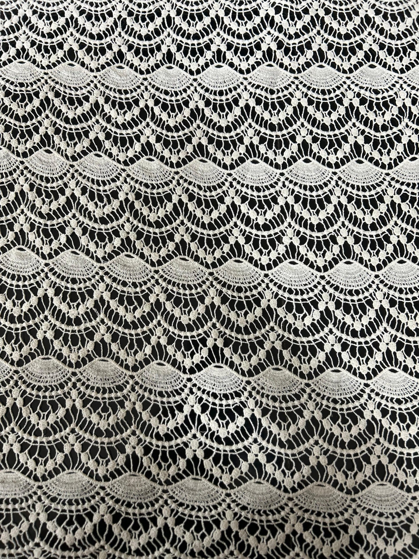High-quality wave-design cutwork lace fabric with detailed scallop motifs — perfect for tunics, tops and resort fashion.