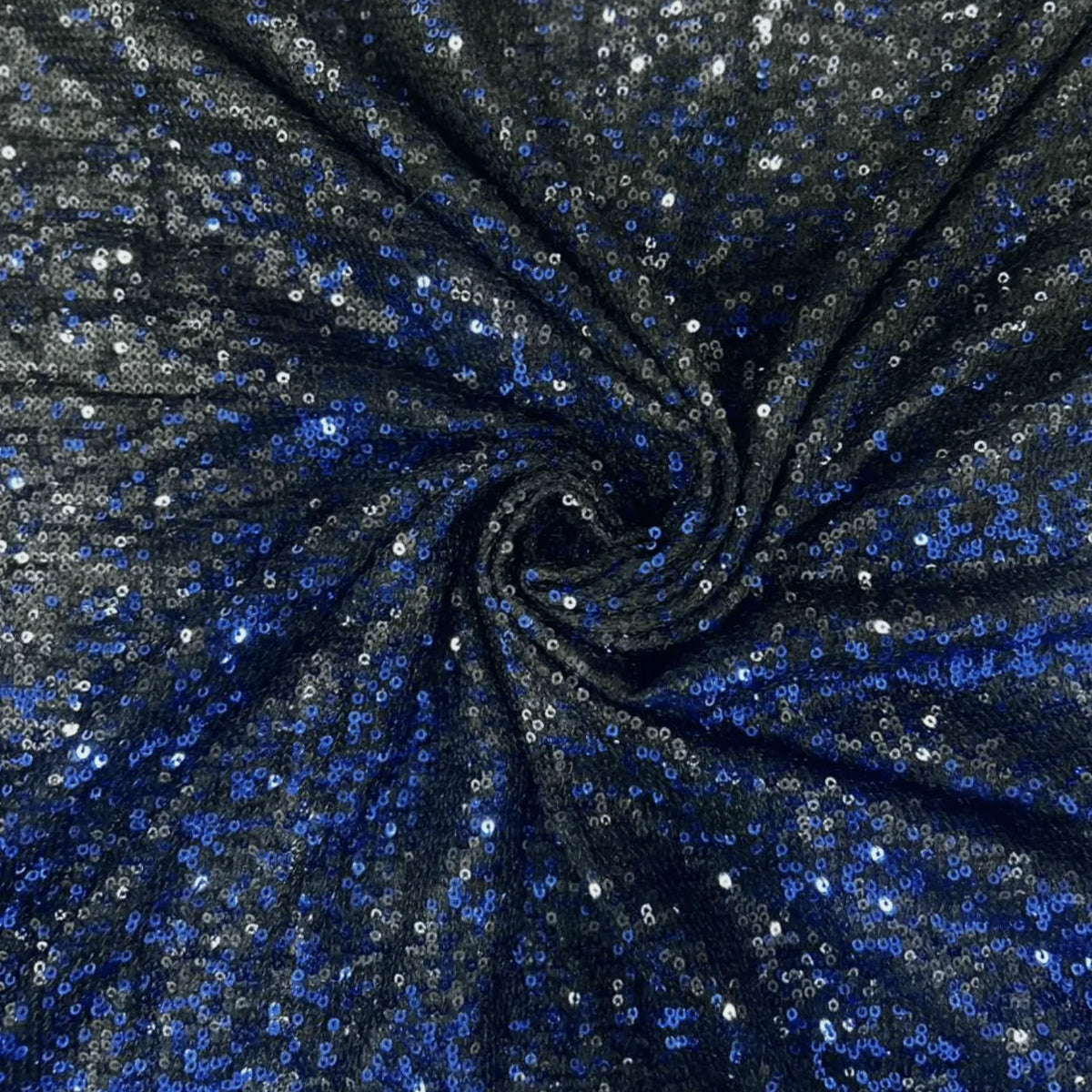 Premium black blue dual tone sequins net fabric arranged in a spiral drape, featuring heavy all-over blue and silver sequin embroidery on a soft net base with a luxurious shimmer finish, ideal for bridal lehengas, gowns, sarees, cocktail dresses and festive party wear.