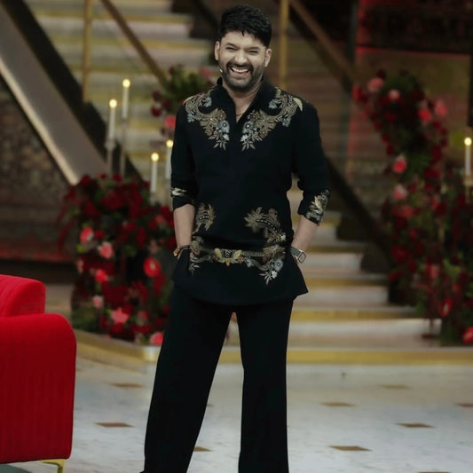 Premium black embroidered kurta fabric inspired by a celebrity-style ethnic look. Soft fabric with elegant floral embroidery, ideal for stitching men's kurtas, festive wear, wedding wear and party outfits. Fabric only, unstitched material.