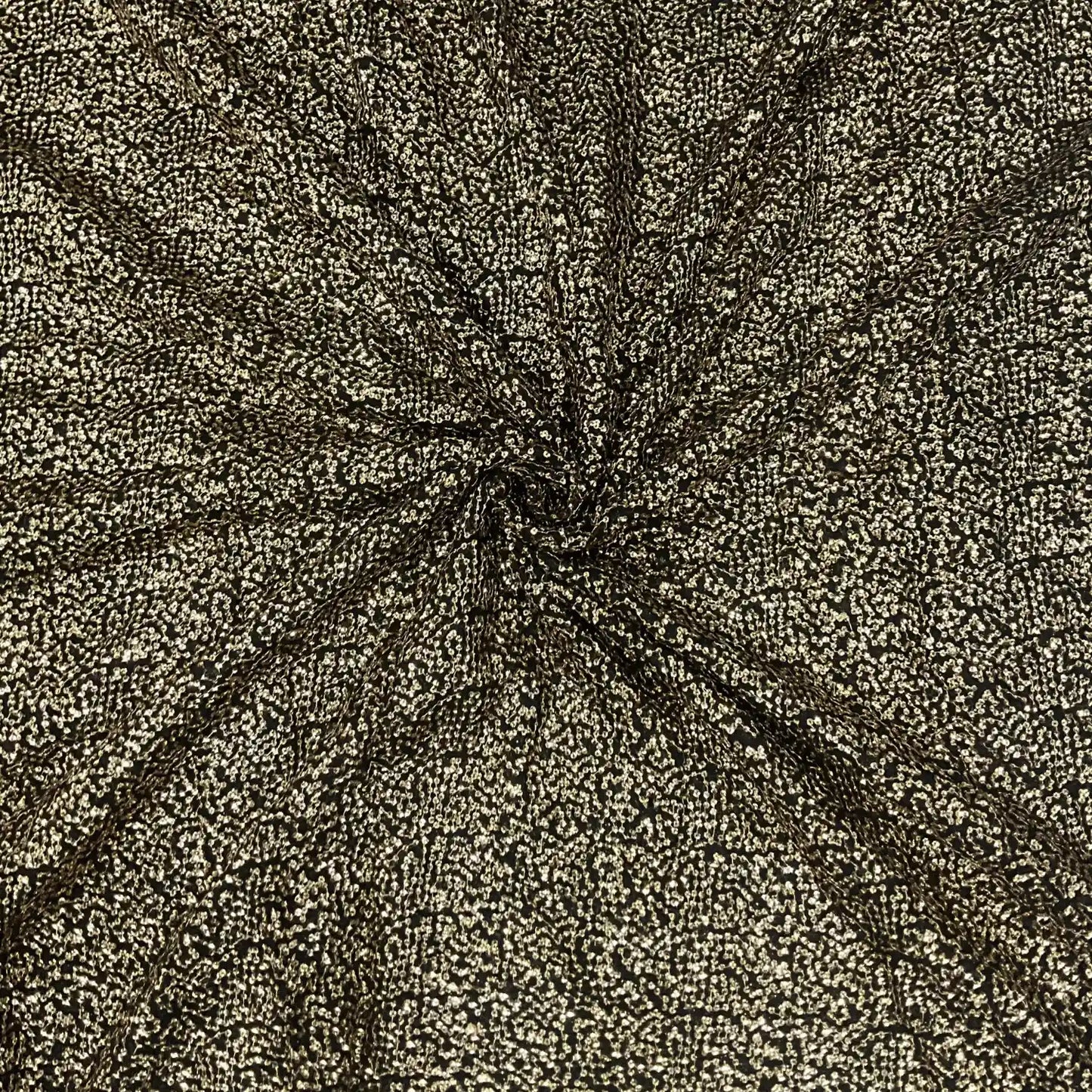 Premium Black Gold Shimmer Georgette Fabric with dense glitter texture and luxurious sparkle, perfect for designer gowns, festive outfits, cocktail dresses and wedding couture.