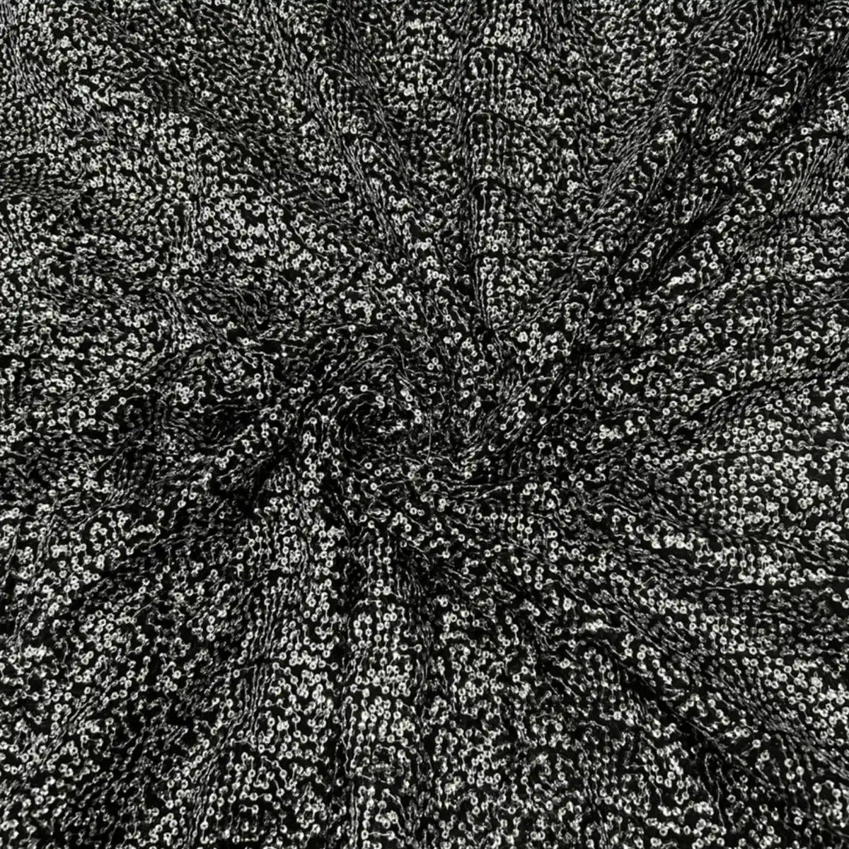 Premium black Kichdi net fabric arranged in a spiral drape, featuring heavy all-over textured Kichdi embroidery on a soft net base with a rich designer shimmer finish, ideal for bridal lehengas, gowns, sarees, blouses and luxury party wear.