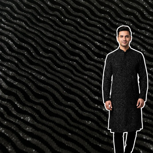 Premium black velvet fabric with metallic wavy pattern for designer garments.