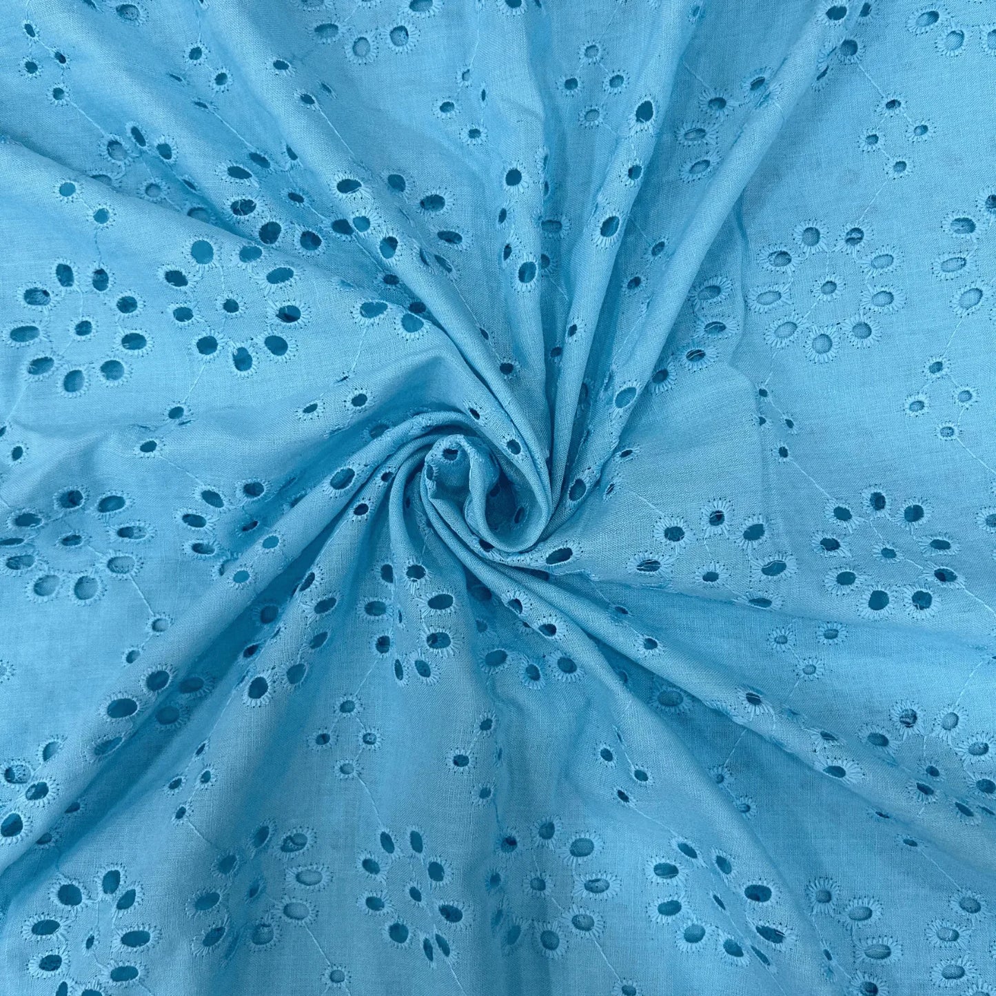 Premium Blue Hakoba Schiffli Cotton Fabric with elegant eyelet embroidery, 44-inch width, soft breathable cotton fabric for kurtis, dresses, salwar suits, tops, blouses and ethnic wear.