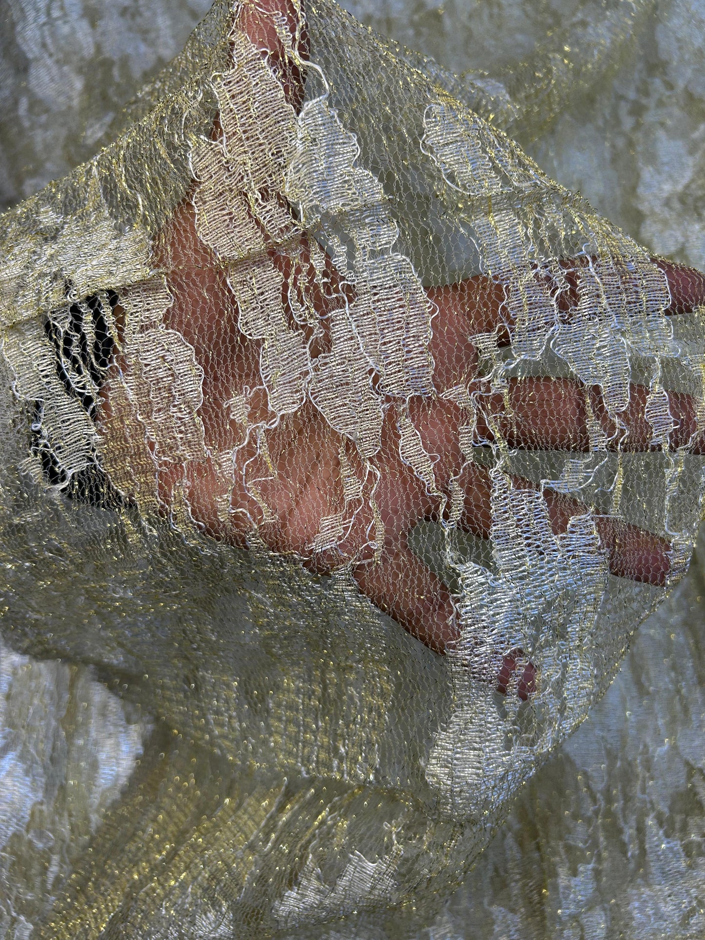 Elegant gold embroidered net material, available by the meter, great for adding a decorative and luxurious touch to any outfit or décor.