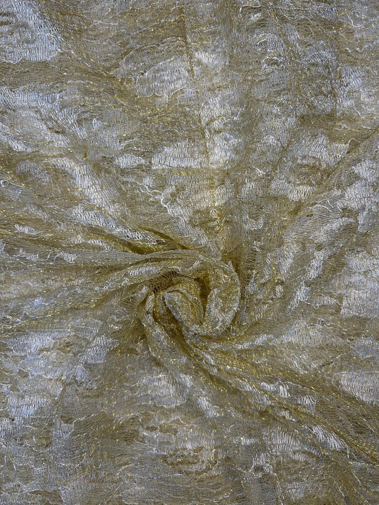 Close-up of shimmering gold decorative net fabric (36-inch width), perfect for festive wear, lehengas, and craft projects.