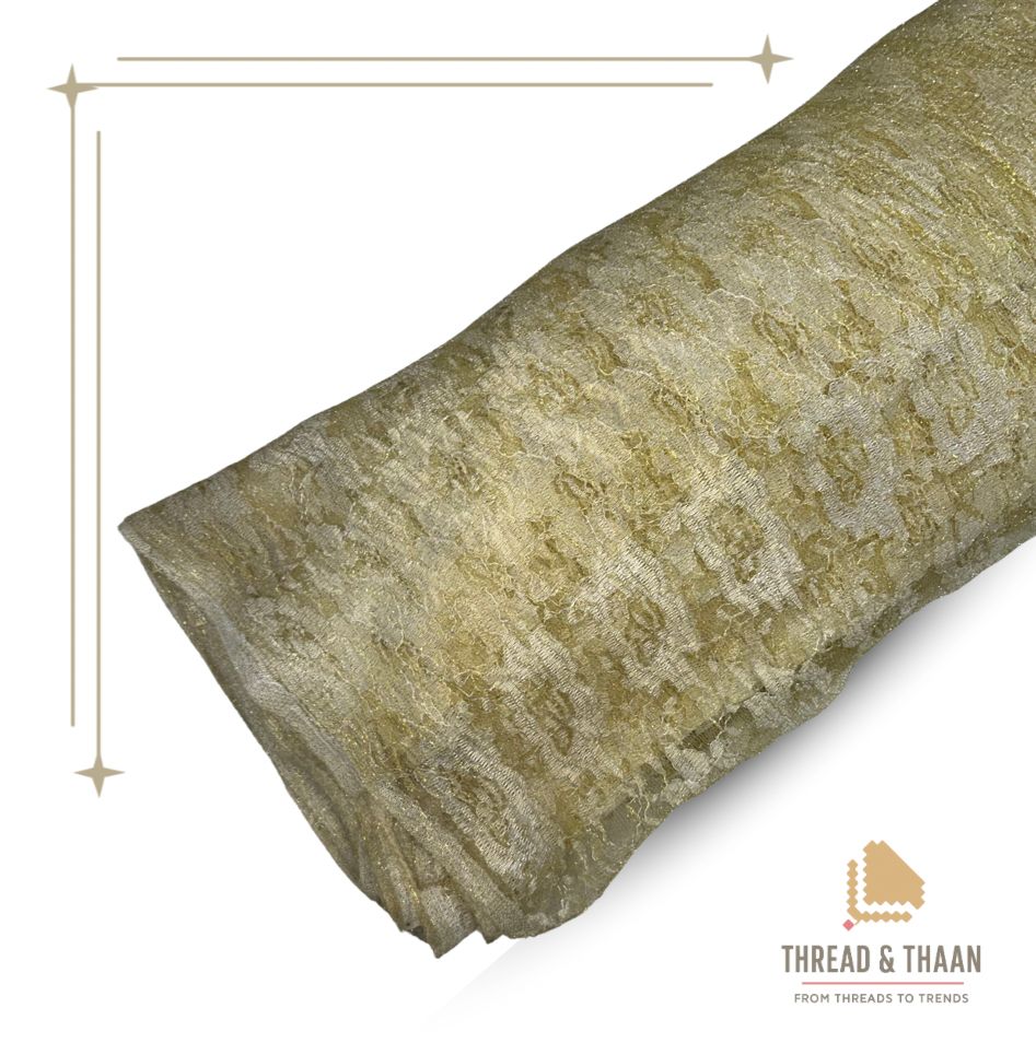 Premium golden net fabric with intricate embroidered thread work, ideal for elegant saree borders, blouses, dupattas, and gowns.