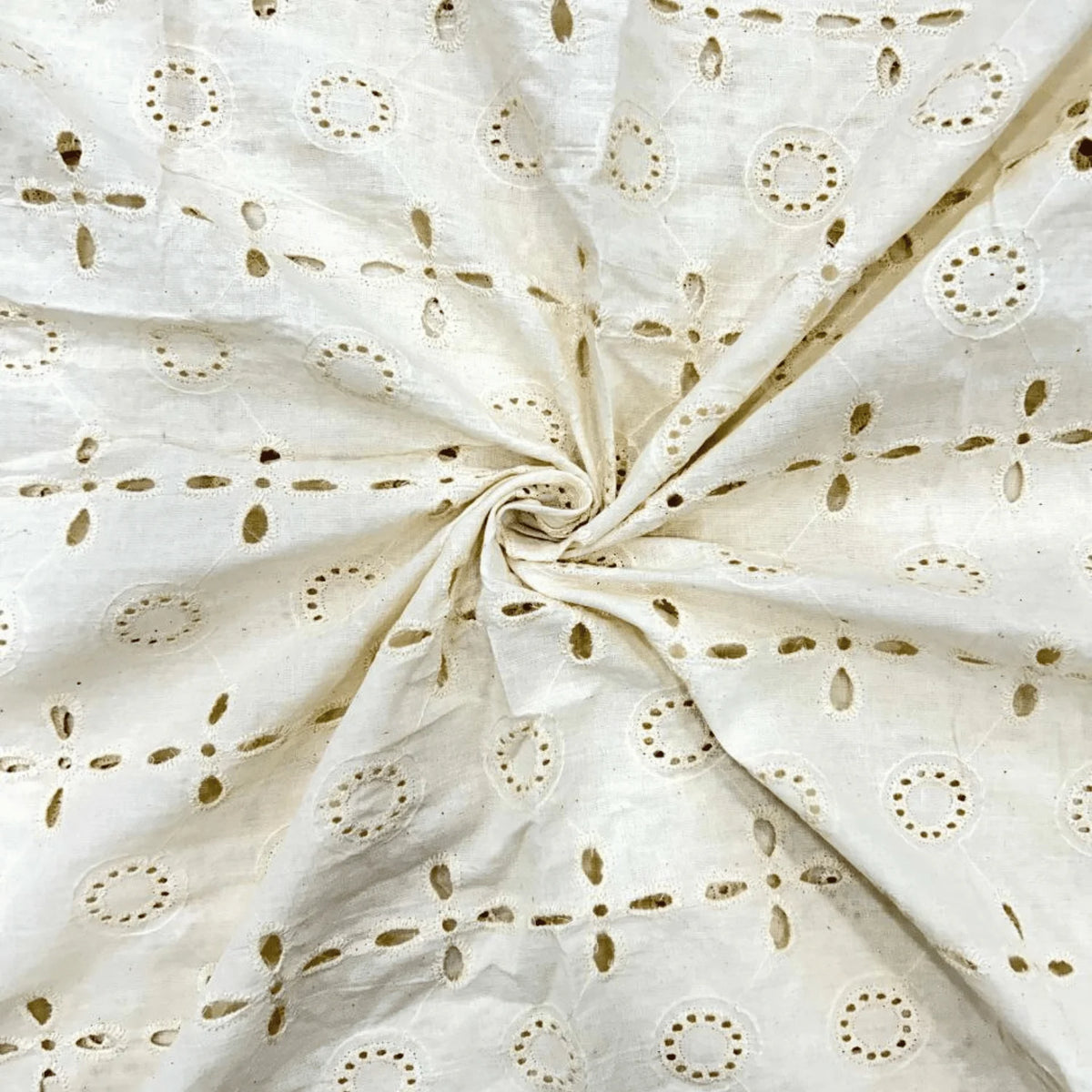 Dyeable White Hakoba Schiffli Cotton Embroidery Fabric featuring elegant eyelet cutwork design, 44-inch width, premium cotton fabric ideal for kurti, dress material, salwar suit, tops, blouses and ethnic fashion wear.