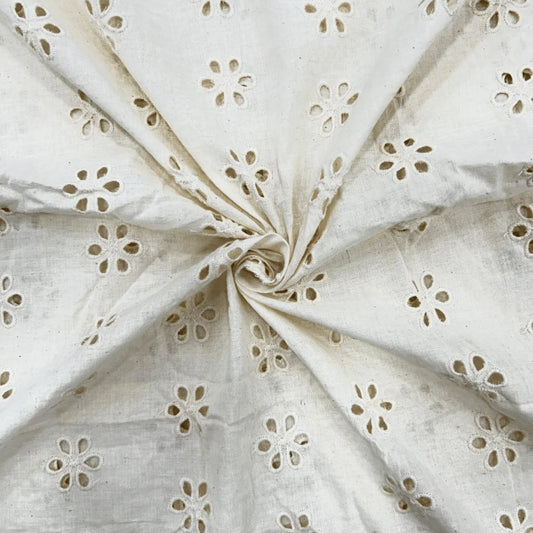 Dyeable white Hakoba Schiffli cotton fabric with floral eyelet embroidery, soft breathable 100% cotton, 44-inch width, ideal for kurtis, dresses, tops, kidswear and DIY sewing projects.