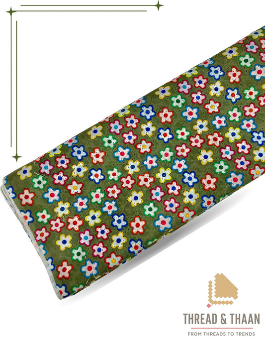 Green pure cotton Hakoba fabric with colorful floral print and embroidery, perfect for stylish festive wear and summer dresses.