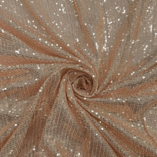 Close-up of premium rose gold sequin net fabric featuring dense all-over shimmer on soft mesh. Perfect for bridal wear, cocktail dresses, gowns, sarees and festive outfits.