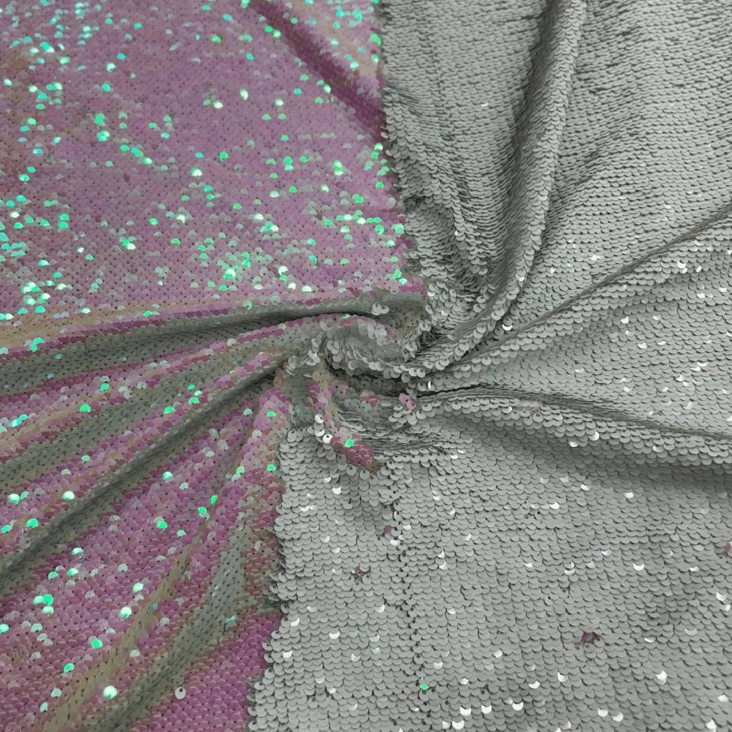 Premium White and Pink reversible sequin mesh fabric with sparkling flip sequins and heavy shimmer finish, ideal for wedding wear, evening gowns, festive dresses and designer apparel.