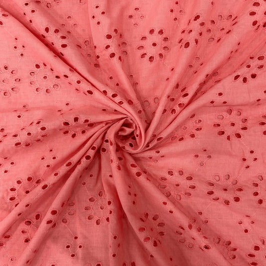 Premium peach Hakoba cotton Schiffli embroidery fabric featuring elegant floral eyelet embroidery. Soft, breathable 100% cotton fabric with 44-inch width, perfect for kurtis, dresses, tops, kidswear and ethnic wear.