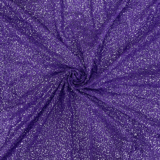 Luxury purple glitter sequin mesh fabric with intricate khichdi sequin work on premium net, ideal for designer gowns, reception wear, ethnic outfits and couture creations.