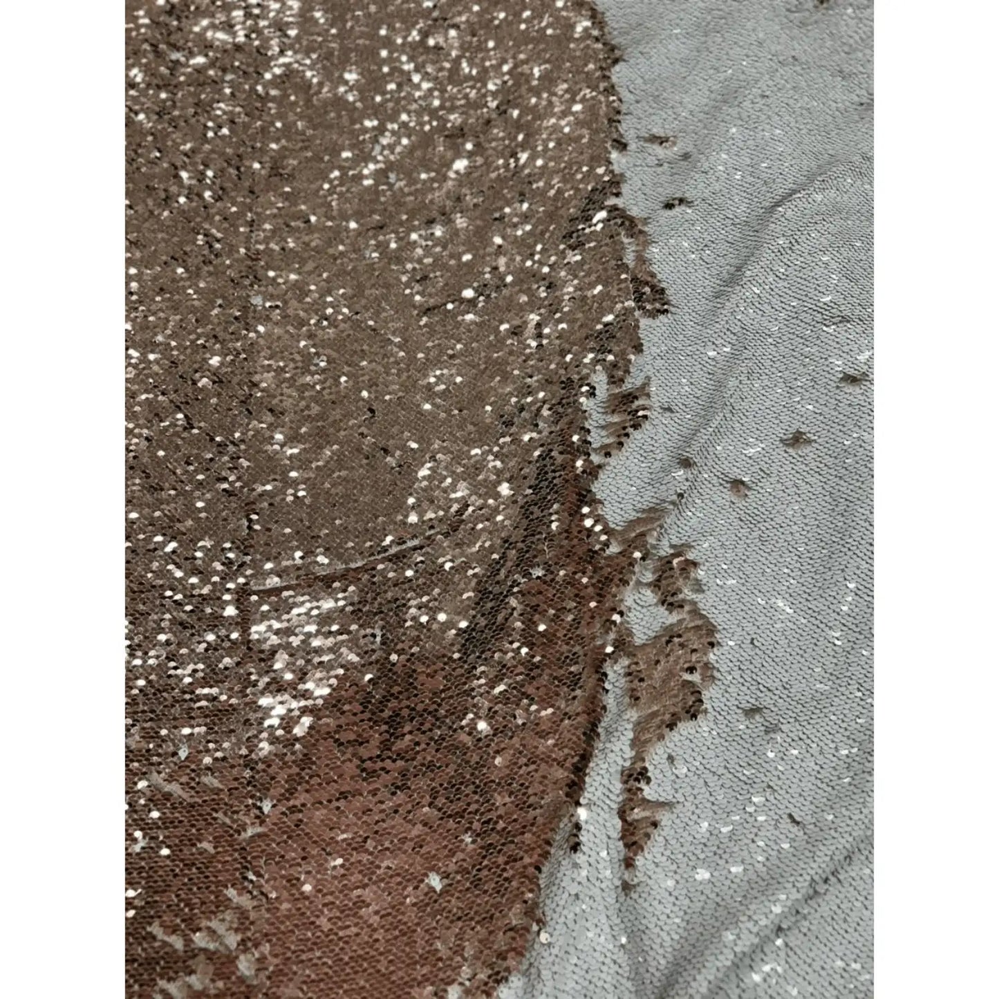 Premium rose gold and white flip sequin net fabric with reversible glitter sequins on soft mesh. Perfect for designer gowns, cocktail dresses, bridal wear, stage costumes and festive outfits.