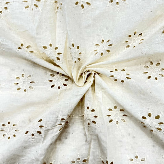 Premium Unique Hakoba Dyeable Cotton Schiffli Fabric with elegant floral eyelet embroidery on soft breathable pure cotton. Dyeable fabric ideal for kurti, dresses, tops, kidswear, ethnic wear and custom fashion. 44-inch width.