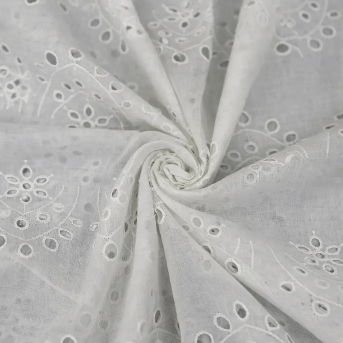 White Hakoba Schiffli cotton fabric with vine eyelet embroidery, 44-inch width.