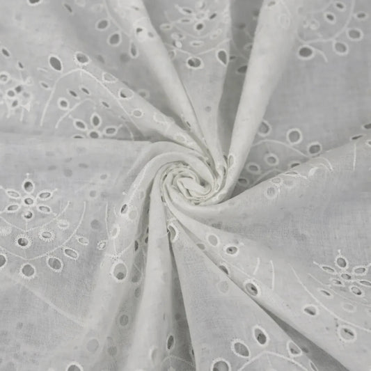 White Hakoba Schiffli cotton fabric with vine eyelet embroidery, 44-inch width.
